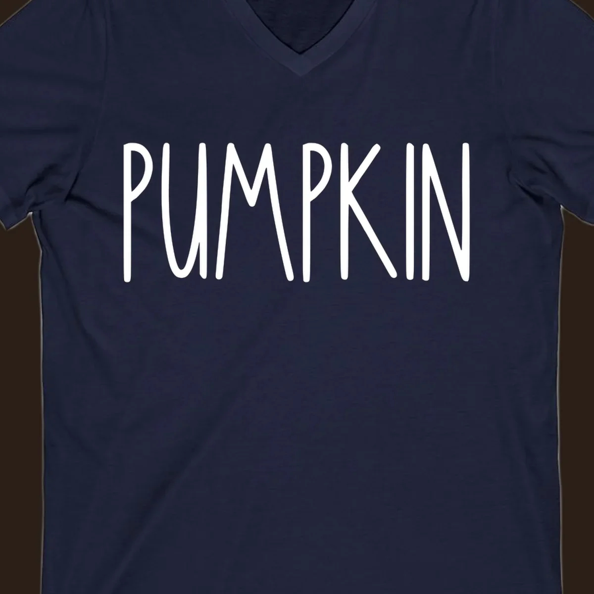 White text design that says PUMPKIN in a bold, hand-drawn font on a black background.