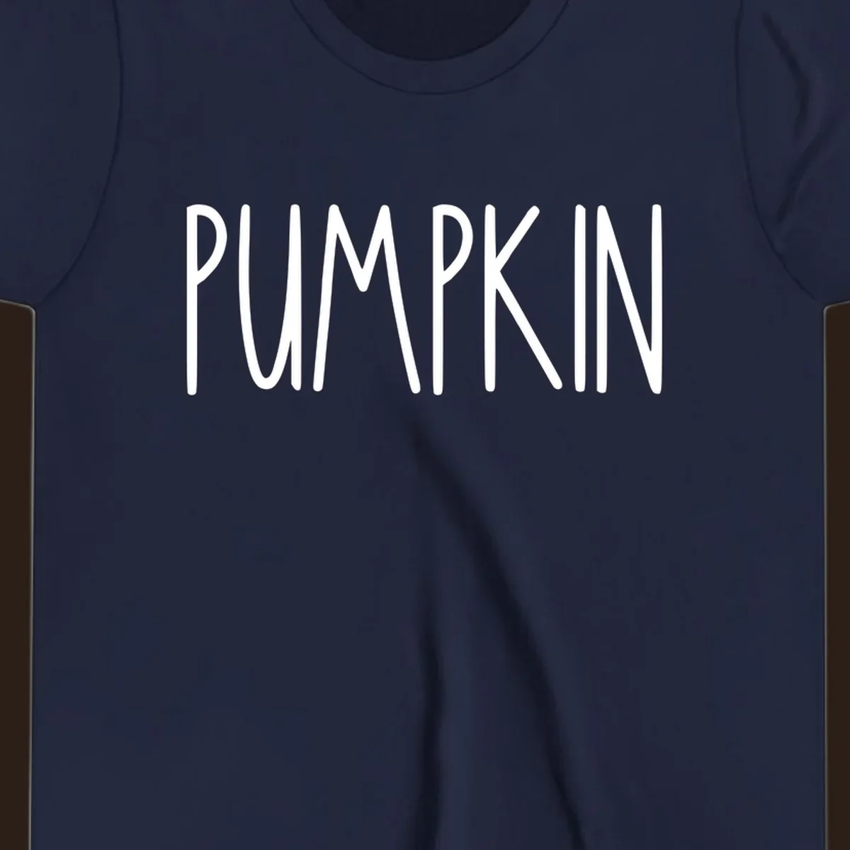 White text design that says PUMPKIN in a bold, hand-drawn font on a black background.