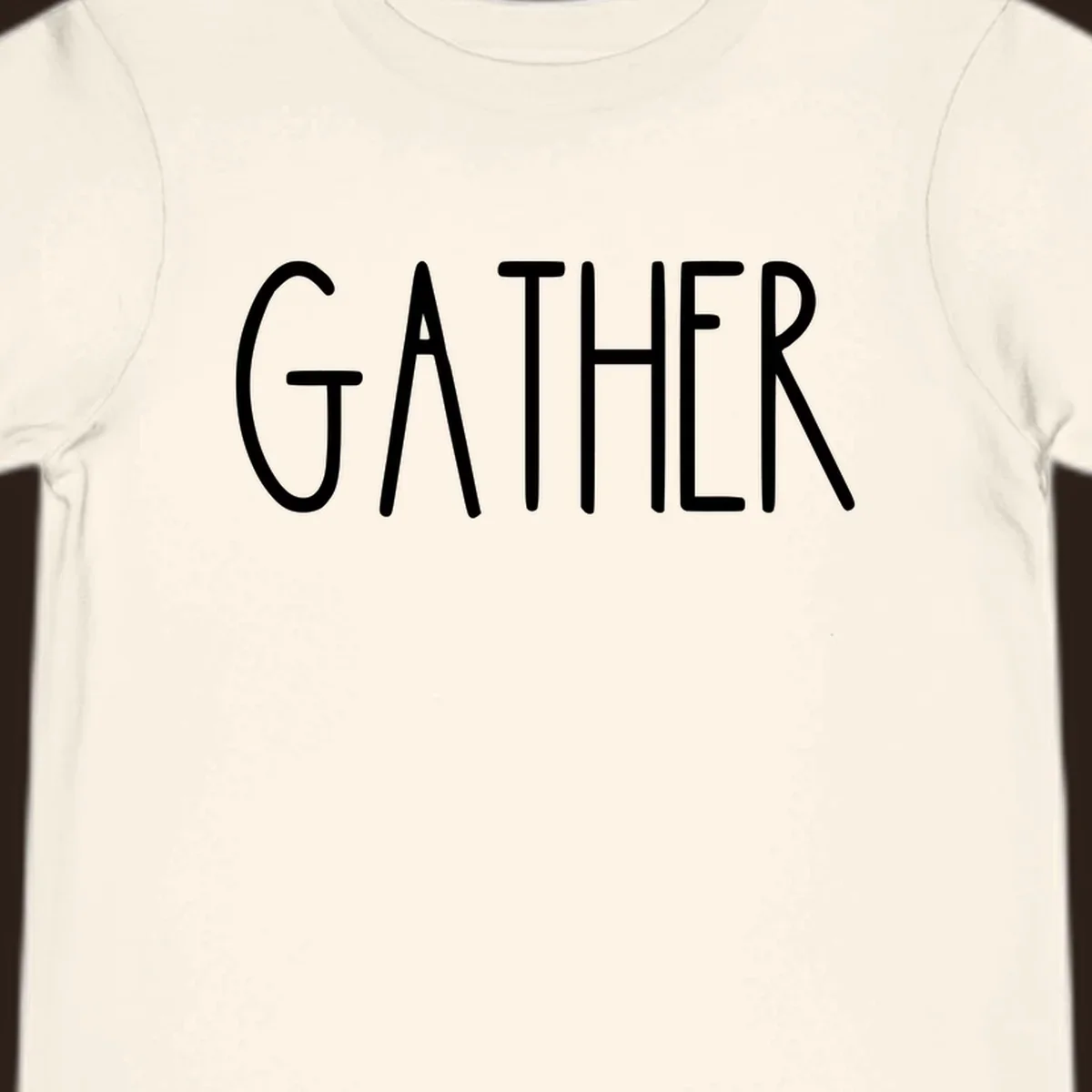 White typography design with the word GATHER, for family dinner gatherings.
