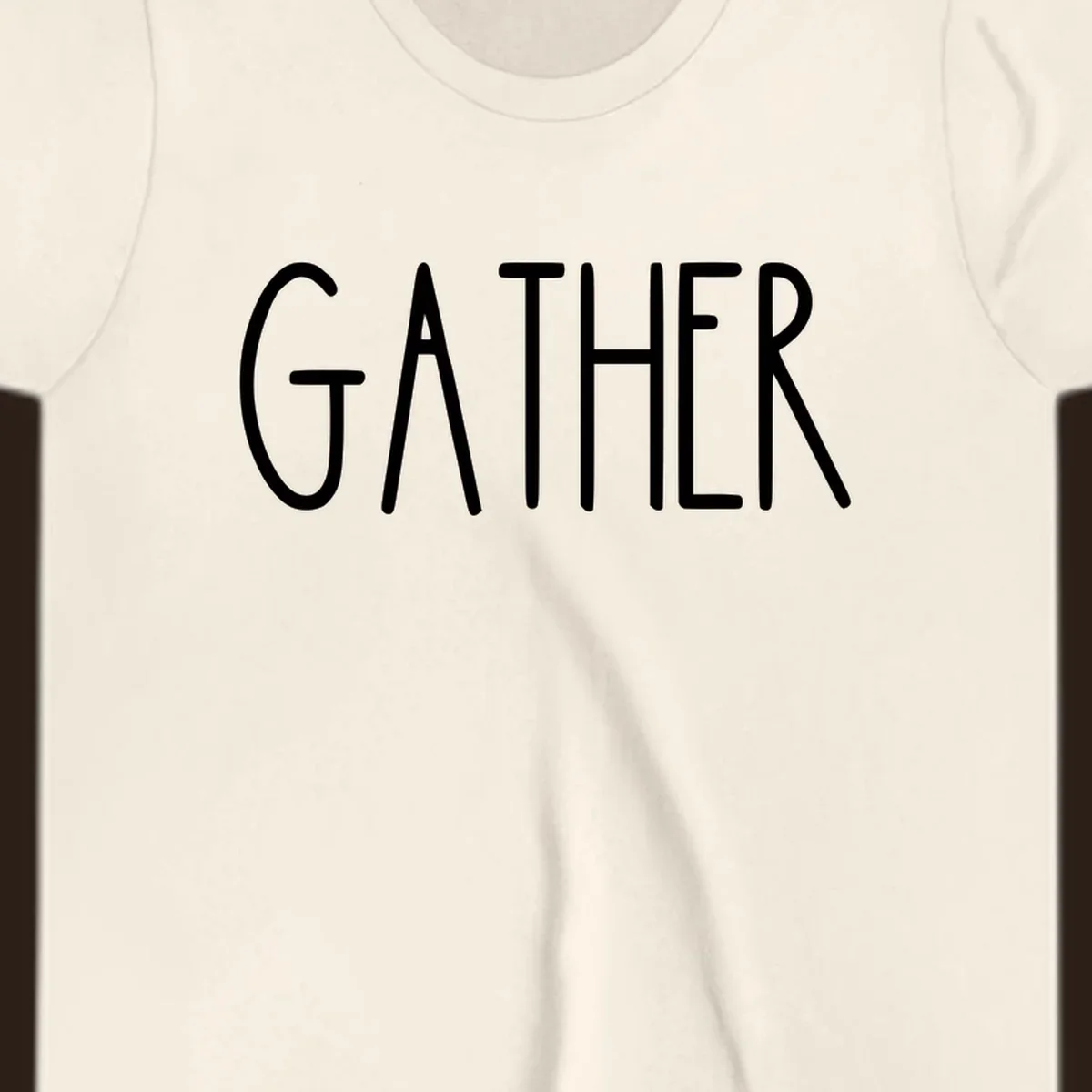 White typography design with the word GATHER, for family dinner gatherings.