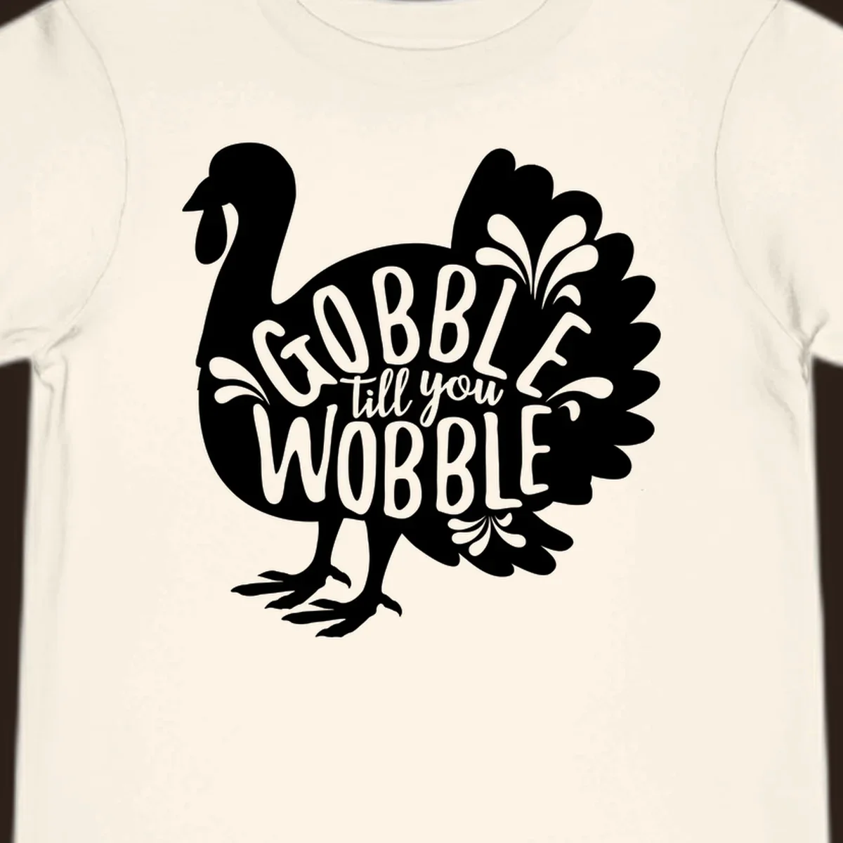 Gobble wobble turkey design with text for Thanksgiving.