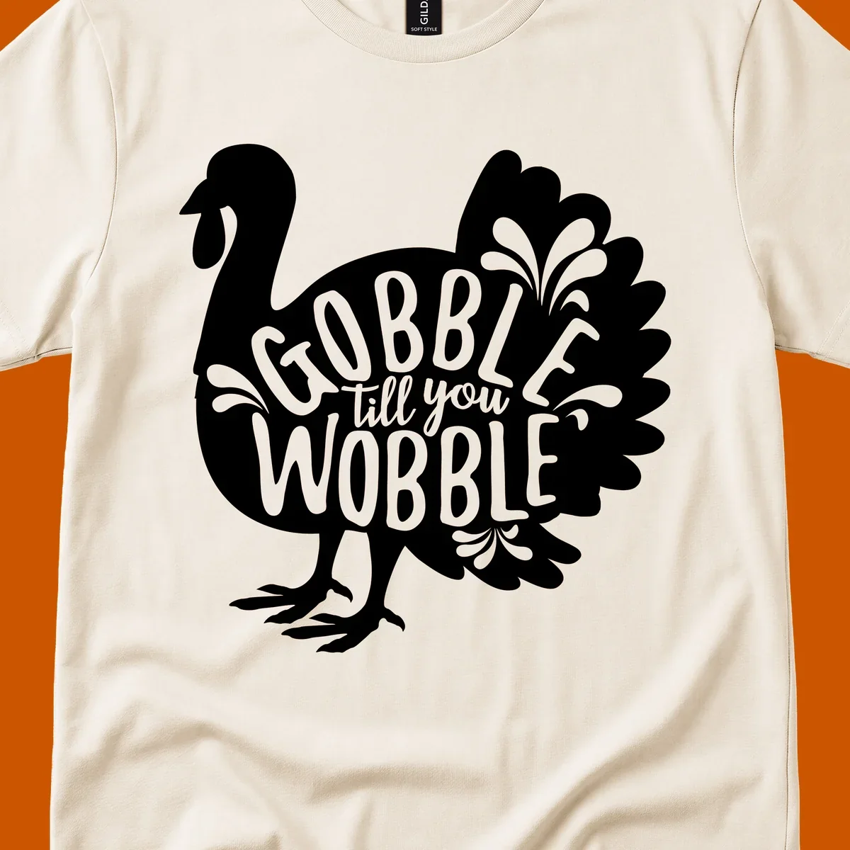 Gobble wobble turkey design with text for Thanksgiving.