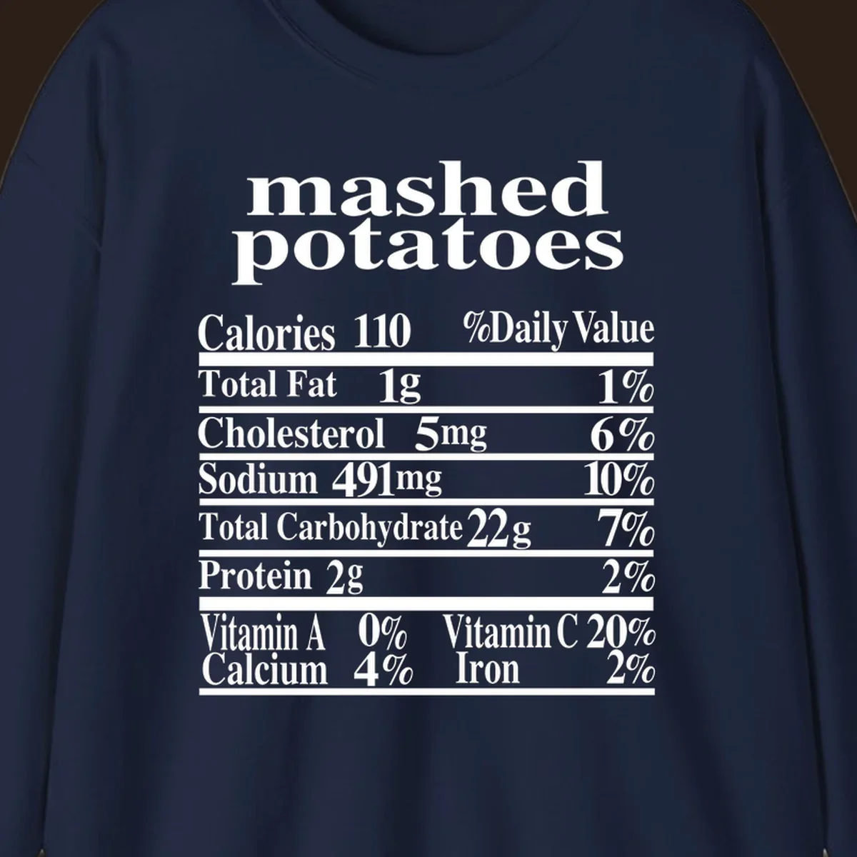 Mashed potato nutrition facts label with calories, fat, cholesterol, sodium, carbs, protein, and vitamins on a black background.