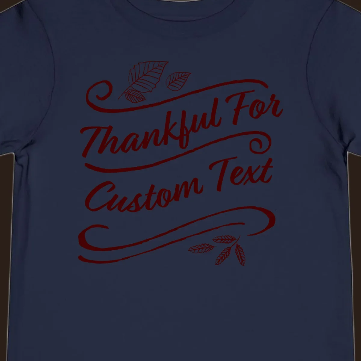 Custom Thanksgiving text with leaves and swirls, dark red on black or white.