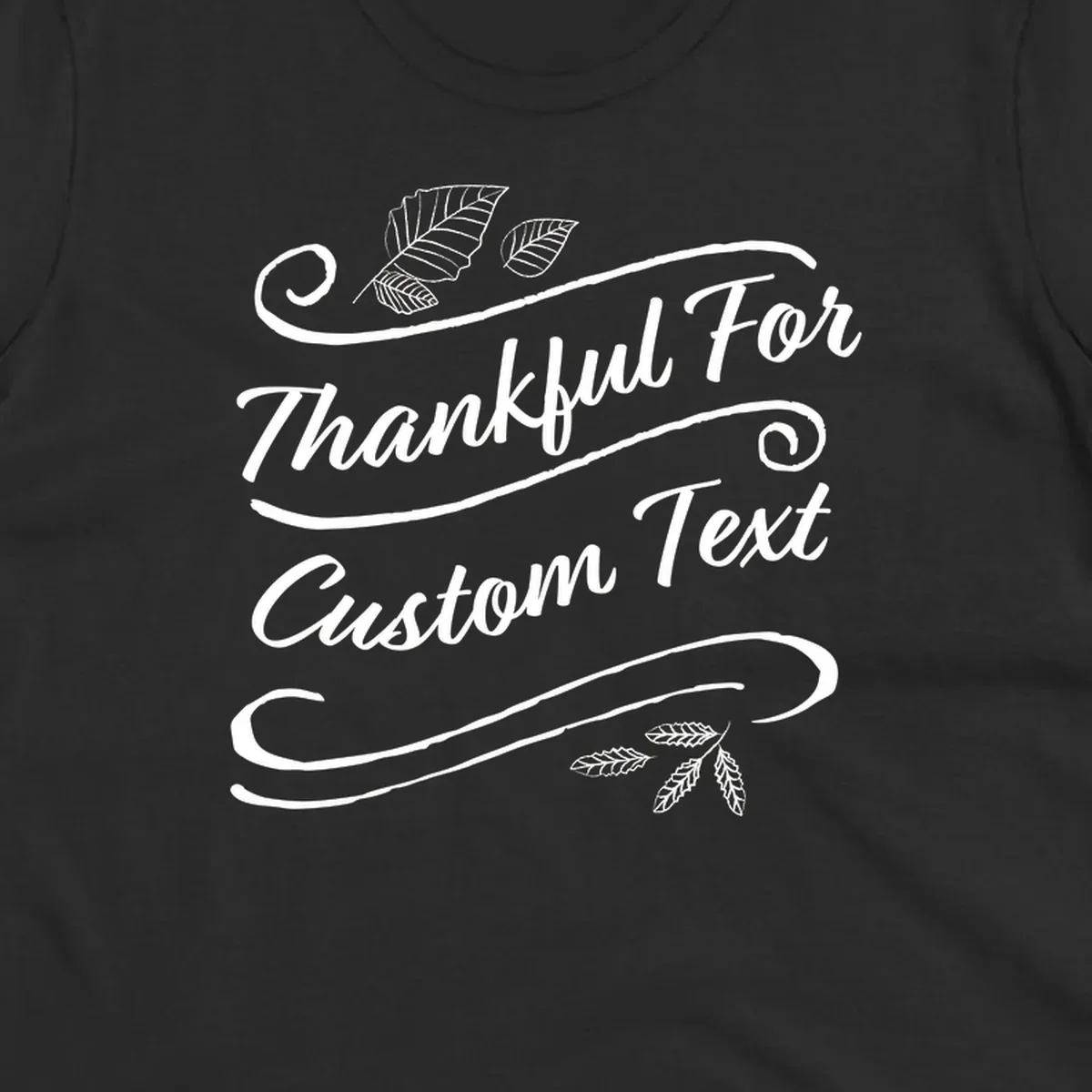 Custom Thanksgiving text design with leaves and swirls.