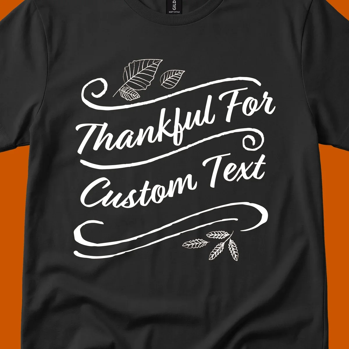 Custom Thanksgiving text design with leaves and swirls.