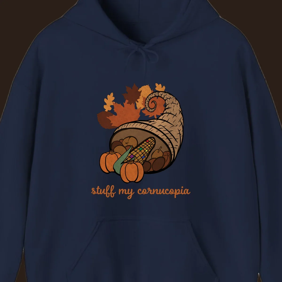 Cornucopia overflowing with harvest food and autumn leaves, with text 'stuff my cornucopia'.