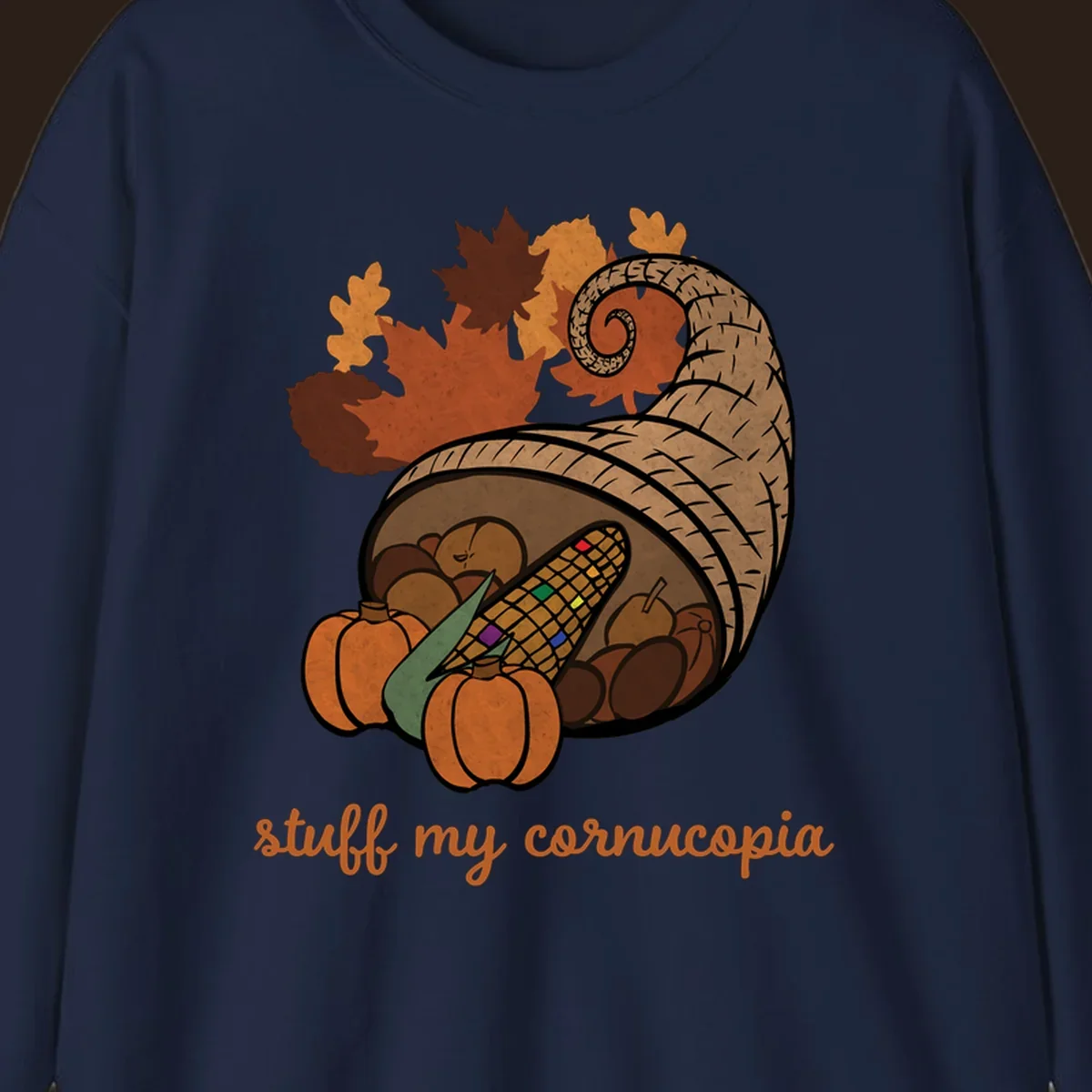 Cornucopia overflowing with harvest food and autumn leaves, with text 'stuff my cornucopia'.