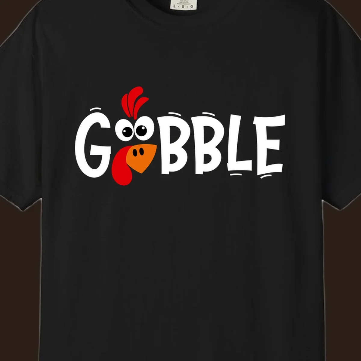 Gobble Gobble Turkey Face design with the word GOBBLE and a cartoon turkey face.
