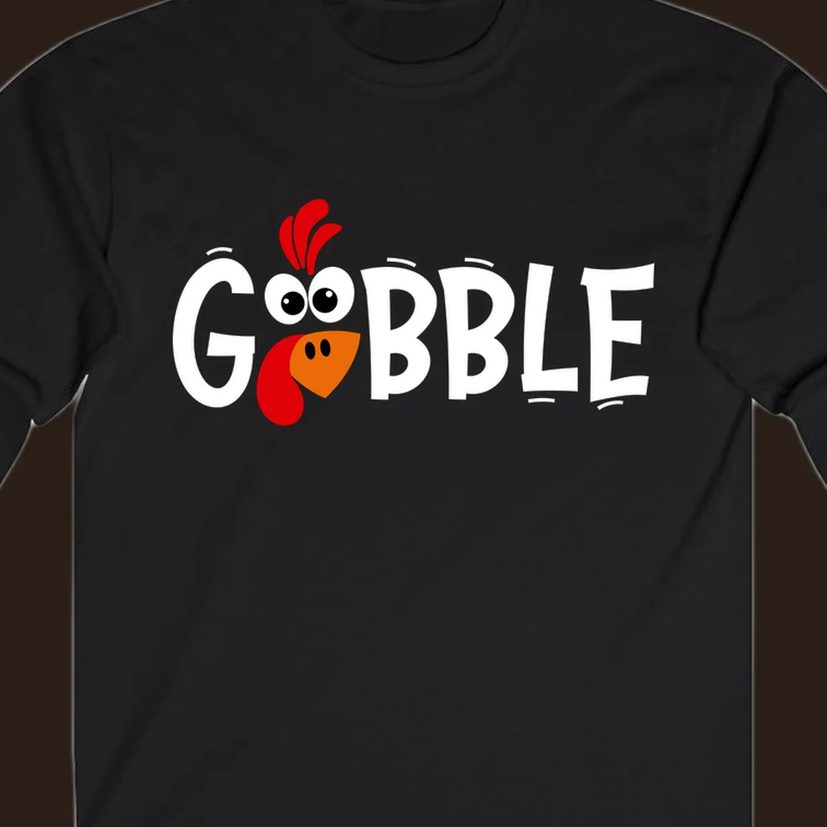 Gobble Gobble Turkey Face design with the word GOBBLE and a cartoon turkey face.