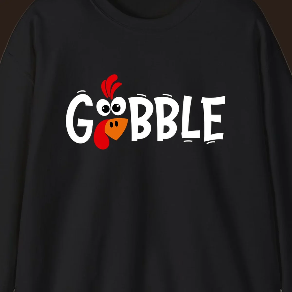 Gobble Gobble Turkey Face design with the word GOBBLE and a cartoon turkey face.