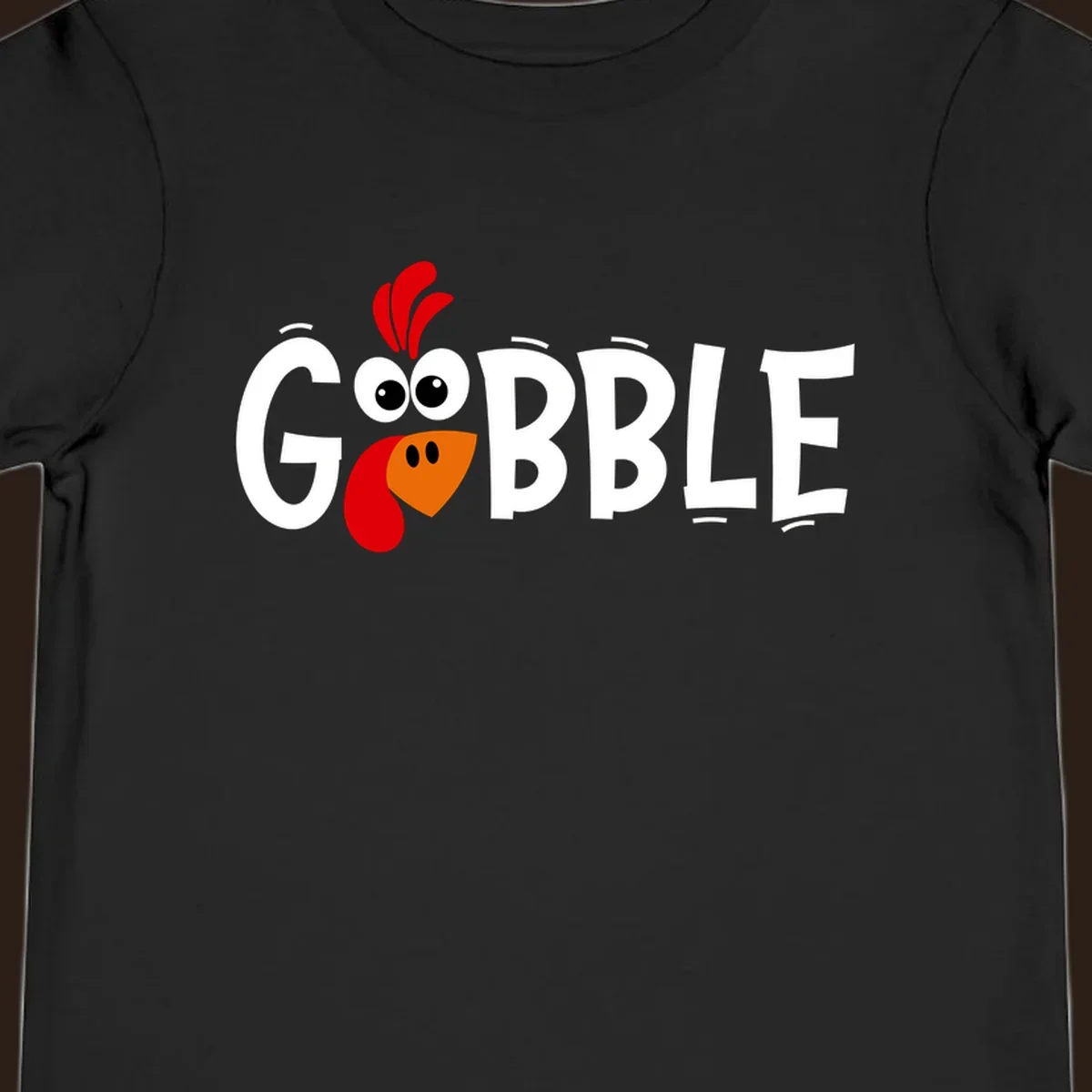 Gobble Gobble Turkey Face design with the word GOBBLE and a cartoon turkey face.