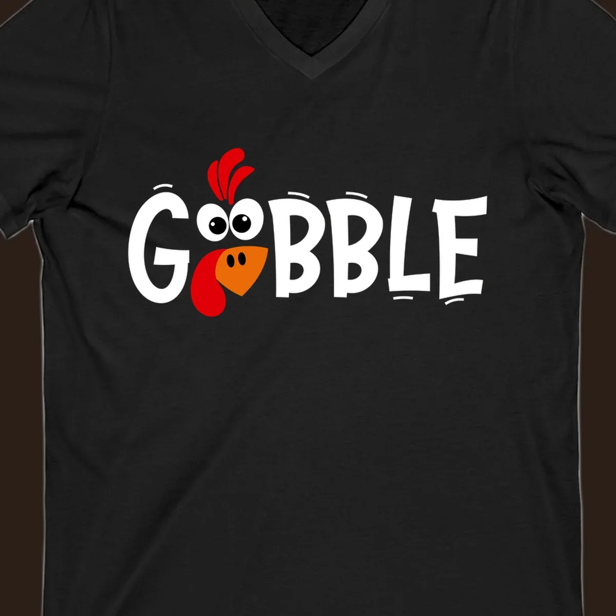 Gobble Gobble Turkey Face design with the word GOBBLE and a cartoon turkey face.