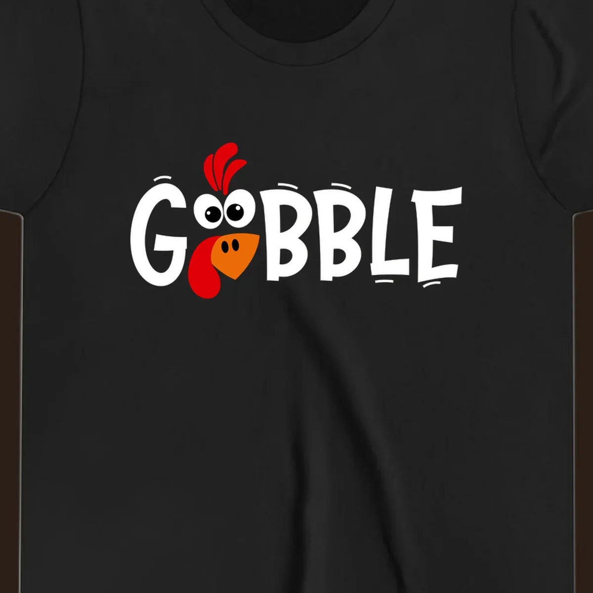 Gobble Gobble Turkey Face design with the word GOBBLE and a cartoon turkey face.