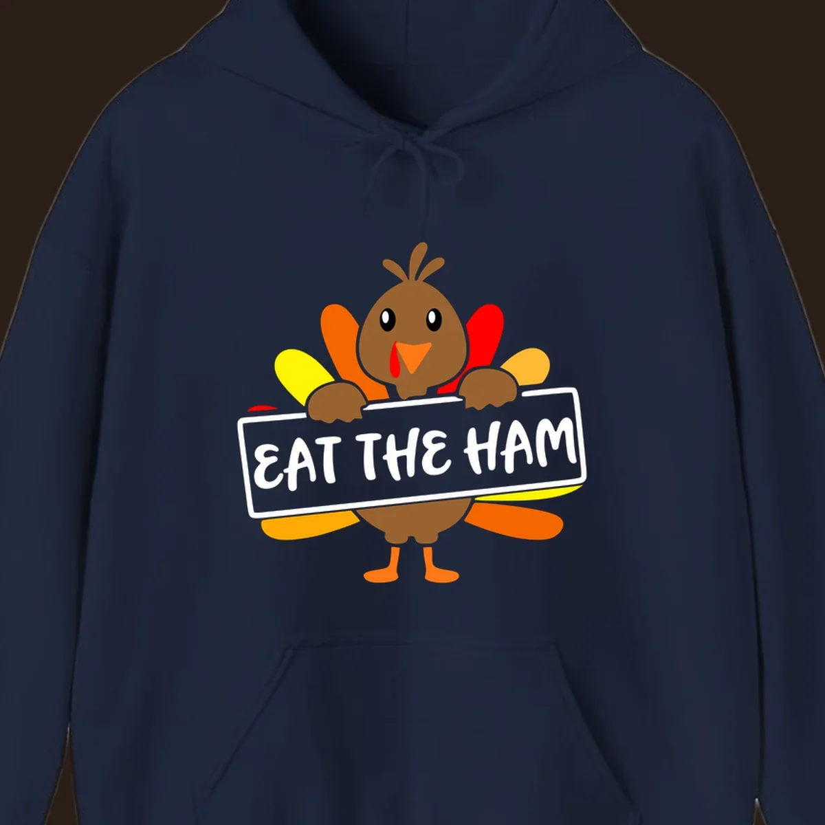 Cartoon turkey holding a sign that says EAT THE HAM, thanksgiving holiday.