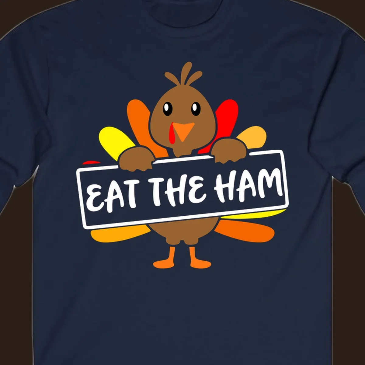 Cartoon turkey holding a sign that says EAT THE HAM, thanksgiving holiday.