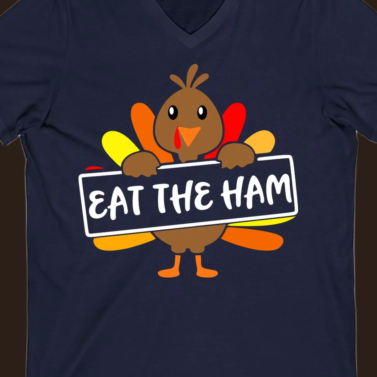 Cartoon turkey holding a sign that says EAT THE HAM, thanksgiving holiday.