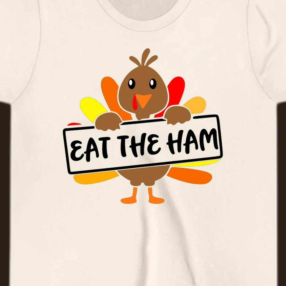 Cartoon turkey holding a sign that says EAT THE HAM, thanksgiving holiday.
