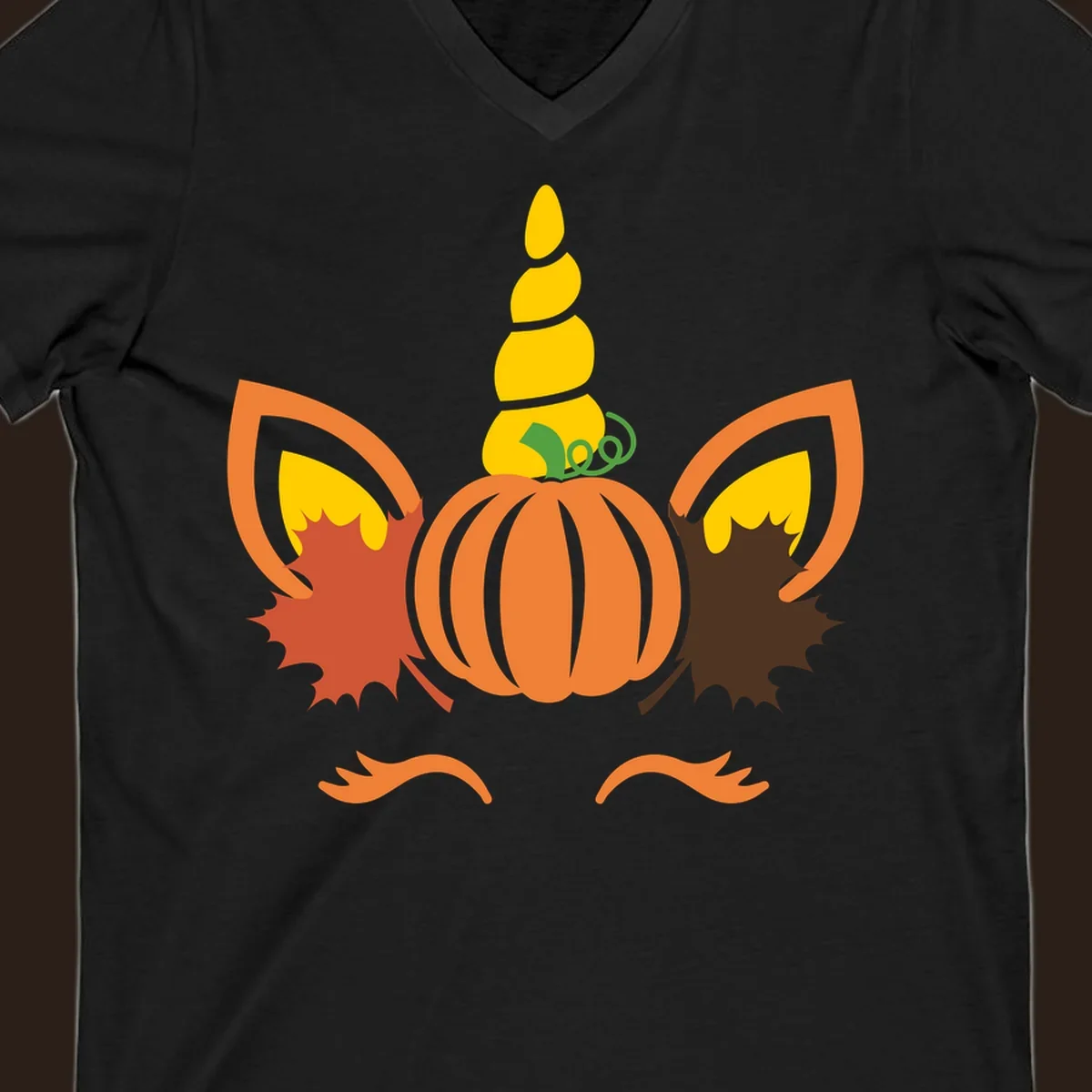 Autumn unicorn pumpkin face with fall leaves graphic.
