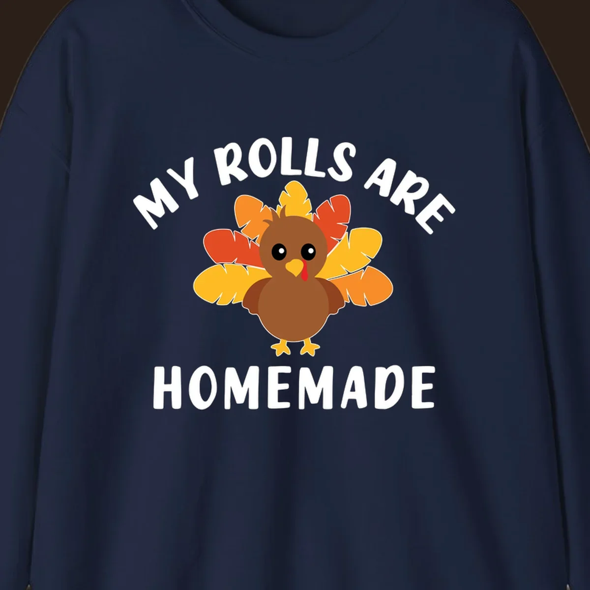 Cute turkey with colorful feathers and text 'My Rolls Are Homemade', Thanksgiving design.