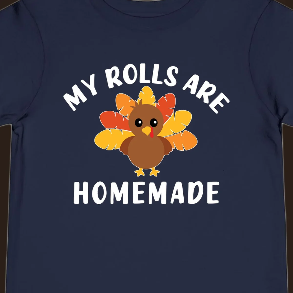Cute turkey with colorful feathers and text 'My Rolls Are Homemade', Thanksgiving design.