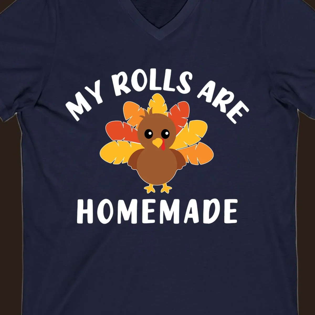 Cute turkey with colorful feathers and text 'My Rolls Are Homemade', Thanksgiving design.