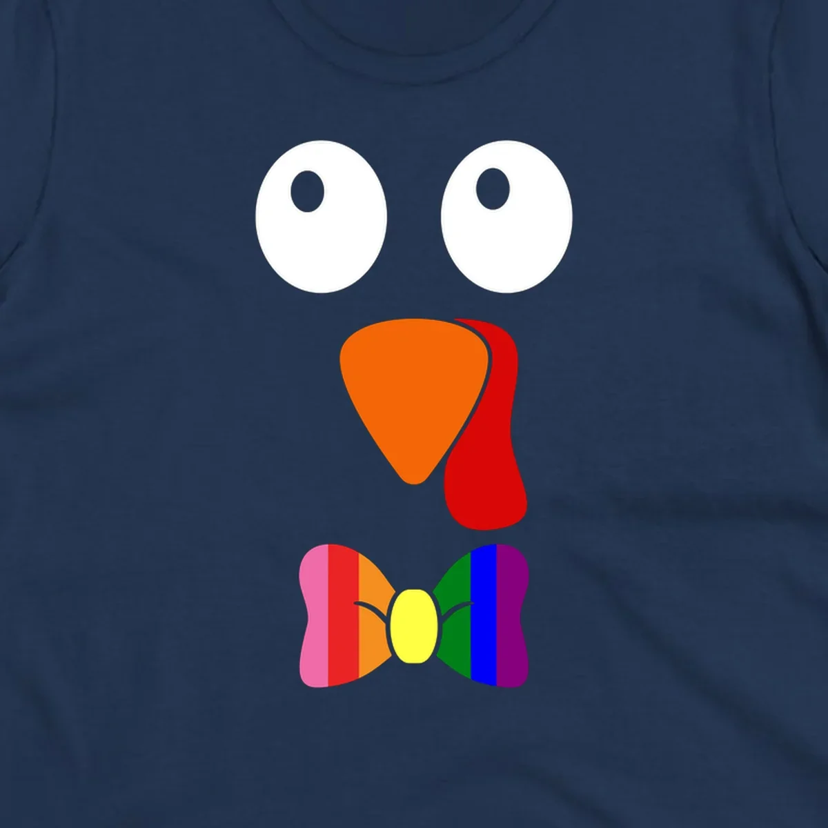 Cartoon turkey face with rainbow bowtie, featuring large eyes, orange beak, and red wattle. Thanksgiving holiday graphic.