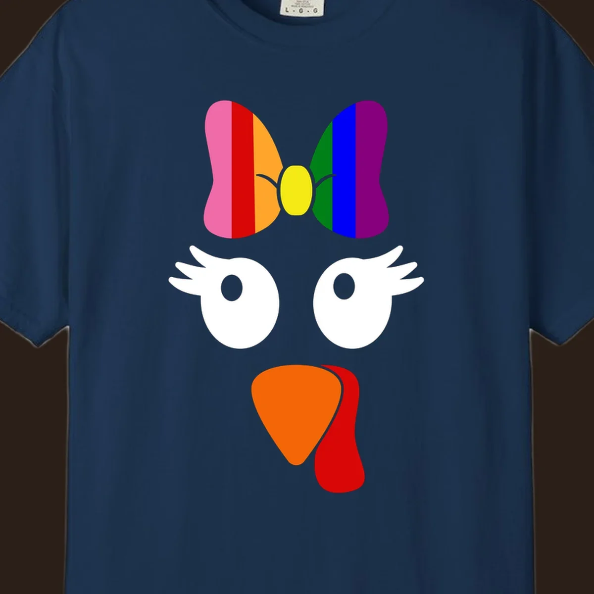 Rainbow turkey face with a bow, graphic for Thanksgiving.
