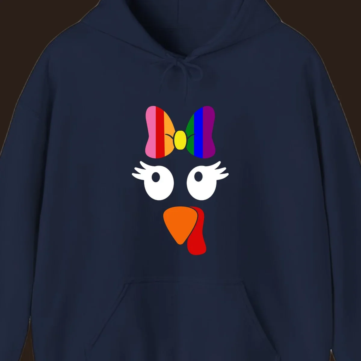 Rainbow turkey face with a bow, graphic for Thanksgiving.