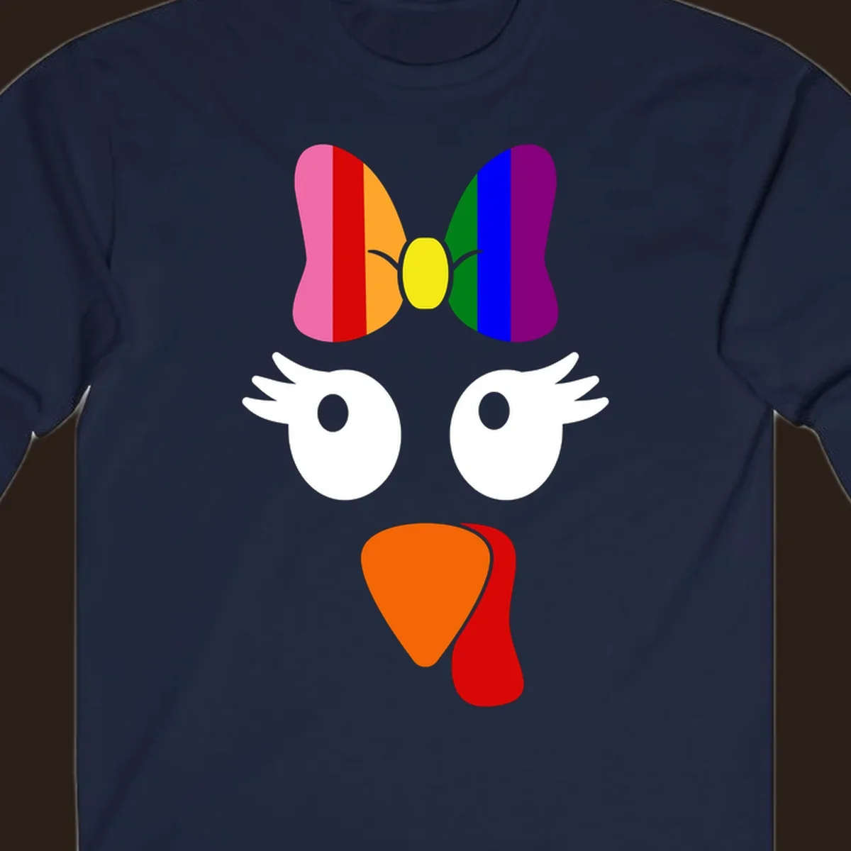 Rainbow turkey face with a bow, graphic for Thanksgiving.