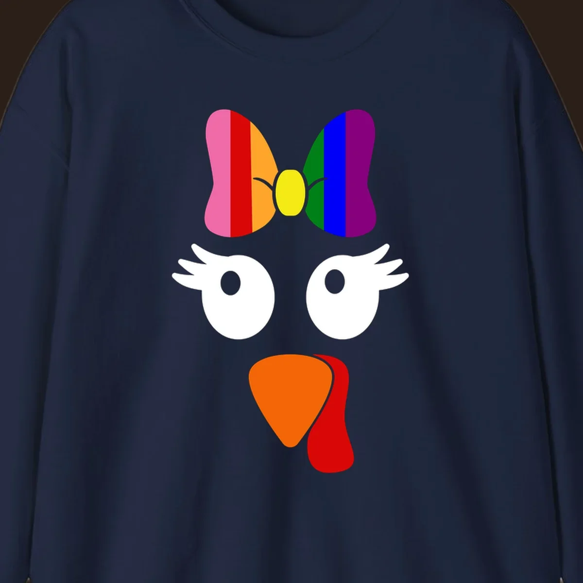Rainbow turkey face with a bow, graphic for Thanksgiving.