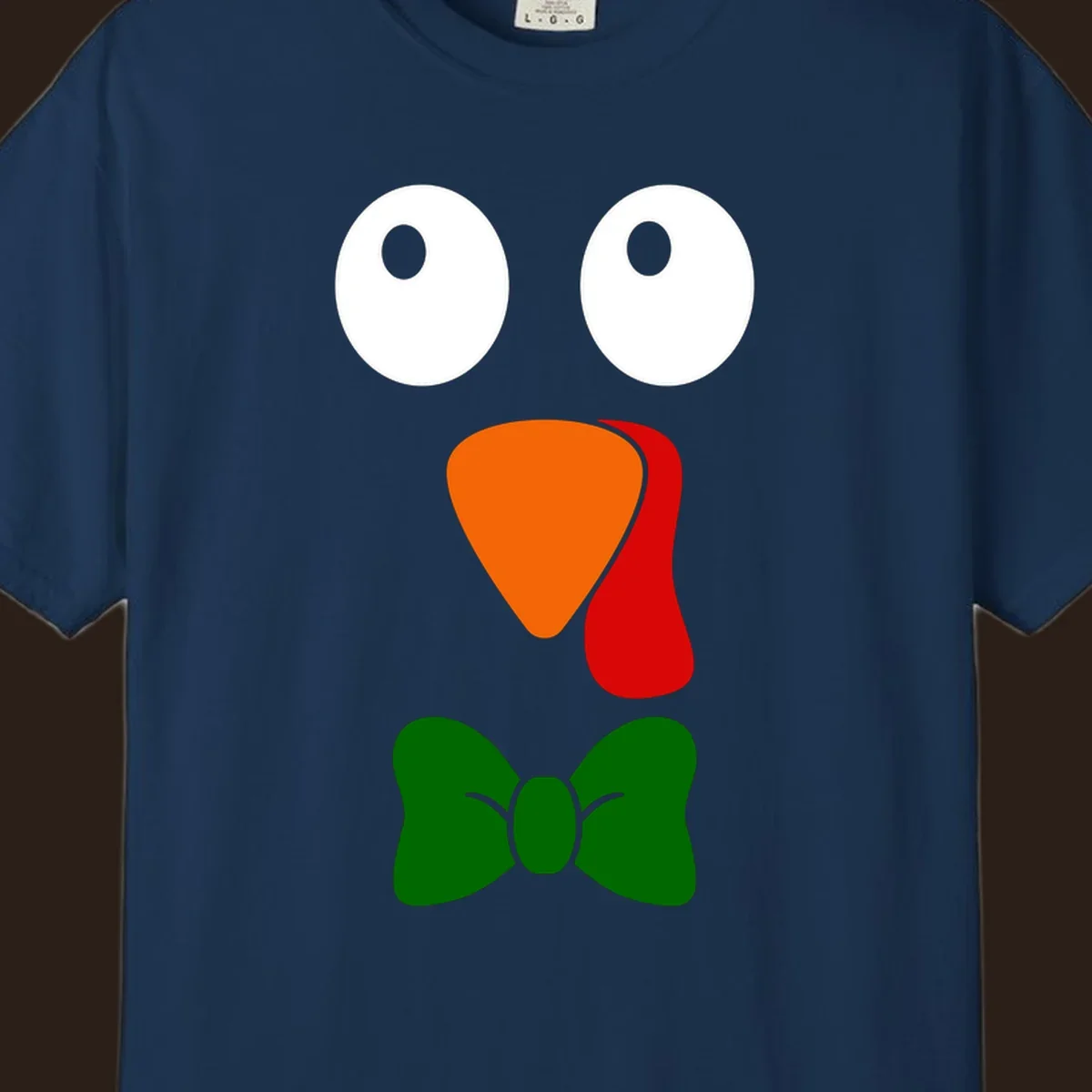 Cute turkey face with bowtie graphic for Thanksgiving.