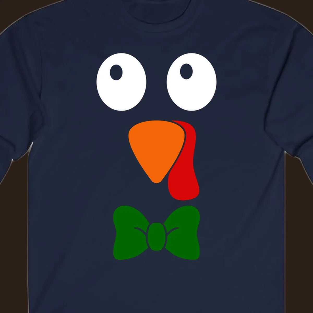 Cute turkey face with bowtie graphic for Thanksgiving.