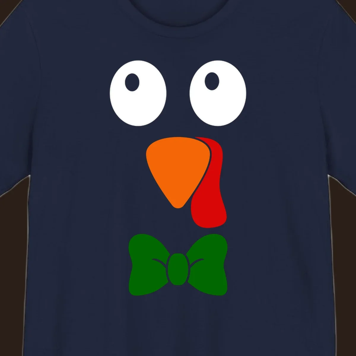 Cute turkey face with bowtie graphic for Thanksgiving.