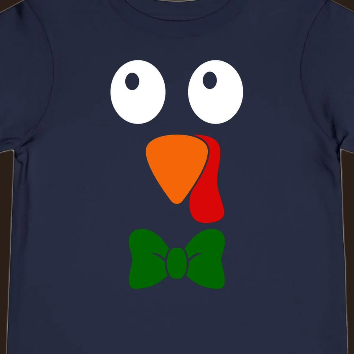 Cute turkey face with bowtie graphic for Thanksgiving.