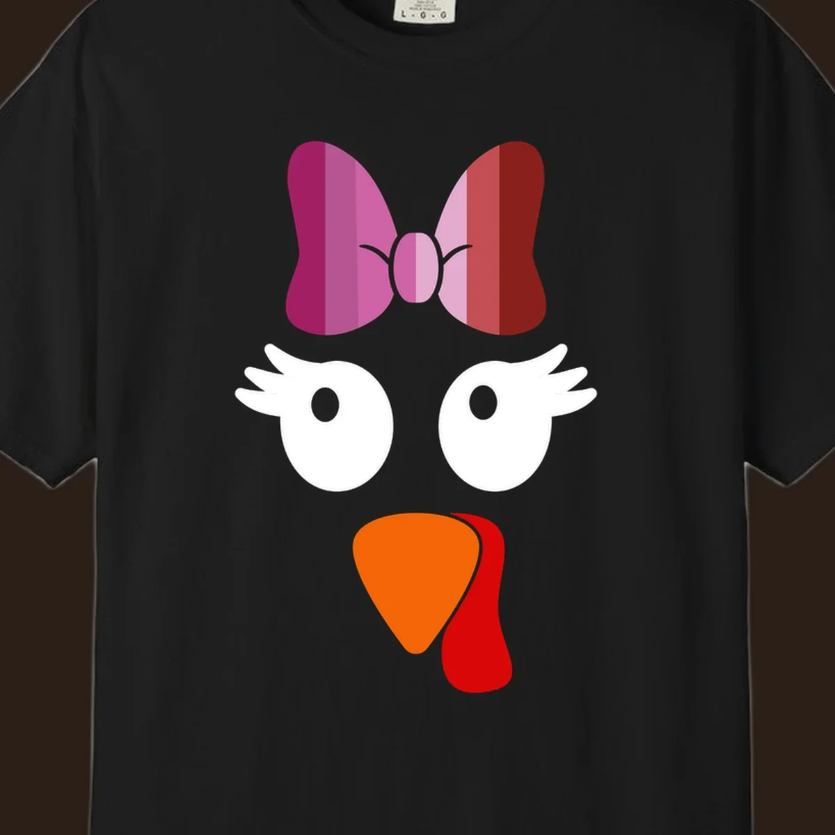 Cute lesbian turkey face with pink and purple bow. Thanksgiving graphic.