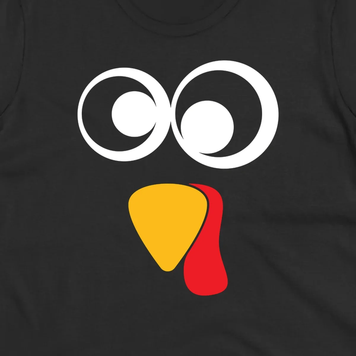 Googly-eyed turkey face illustration with yellow beak and red wattle.