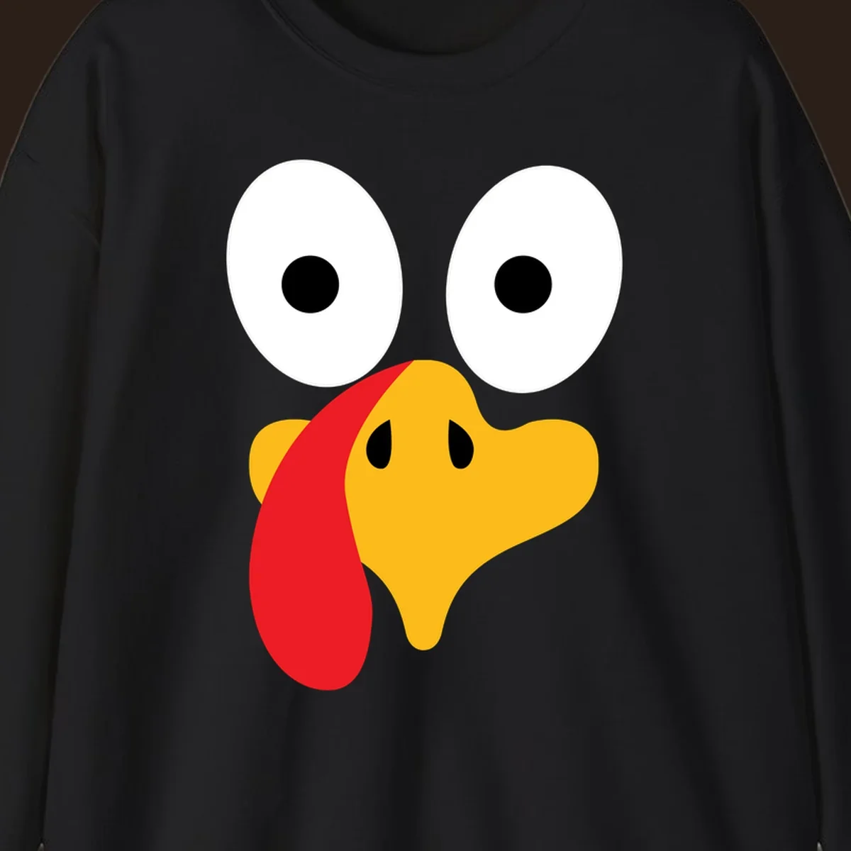 Googly-eyed turkey face illustration for Thanksgiving.