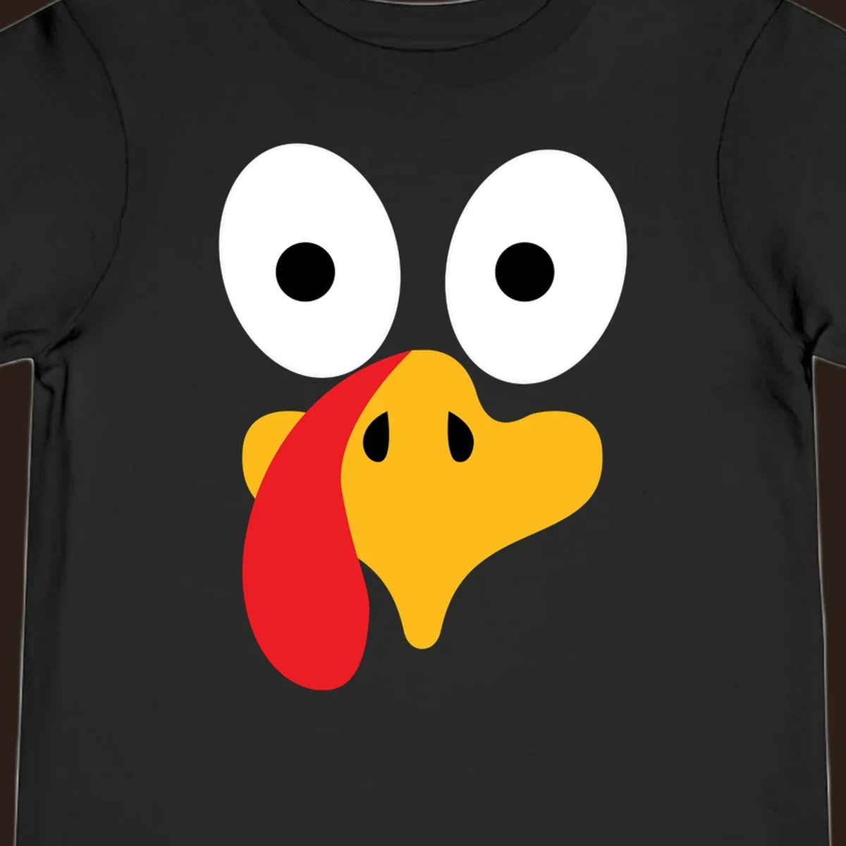Googly-eyed turkey face illustration for Thanksgiving.