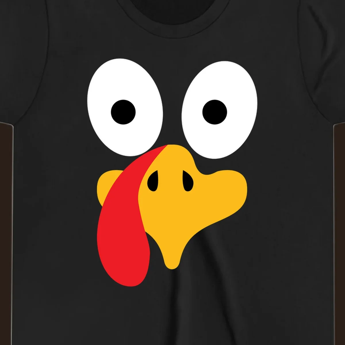 Googly-eyed turkey face illustration for Thanksgiving.