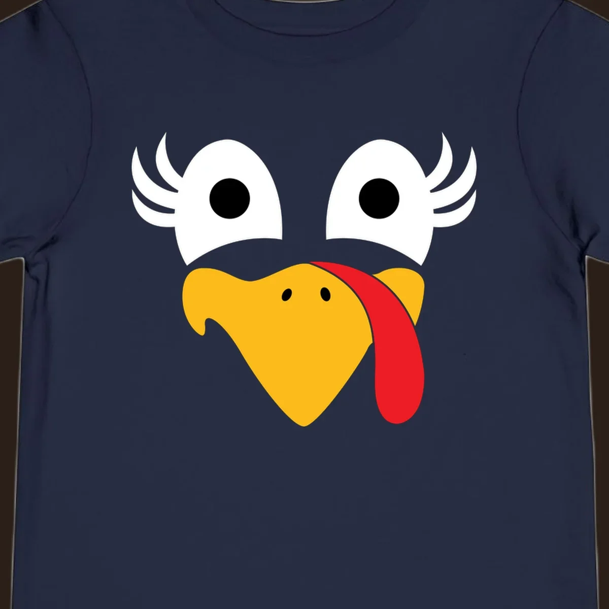 Funny turkey face illustration with googly eyes and a red wattle, for Thanksgiving.