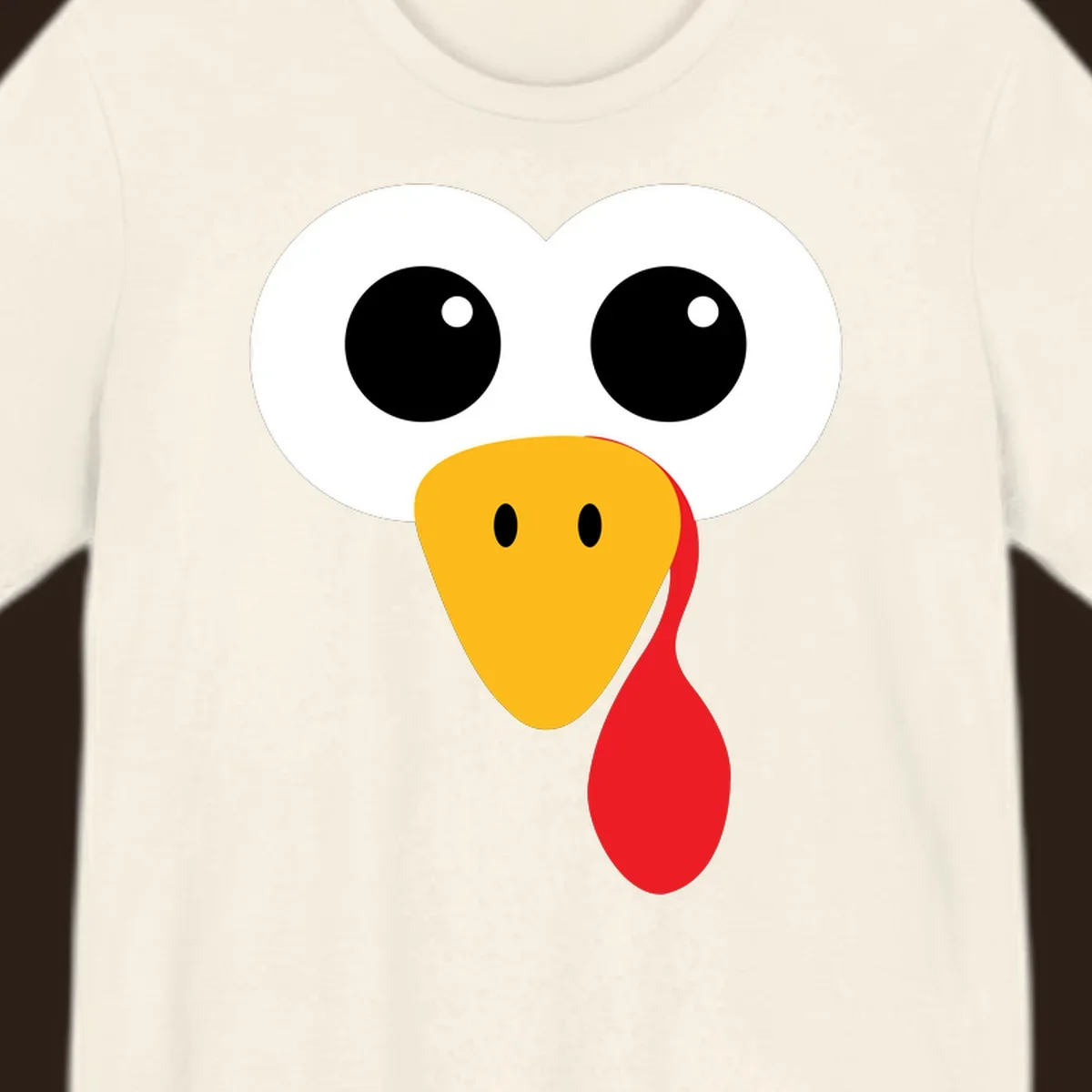 Funny turkey face with googly eyes, yellow beak, and red wattle for Thanksgiving.