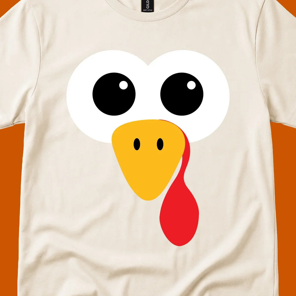 Funny turkey face with googly eyes, yellow beak, and red wattle for Thanksgiving.