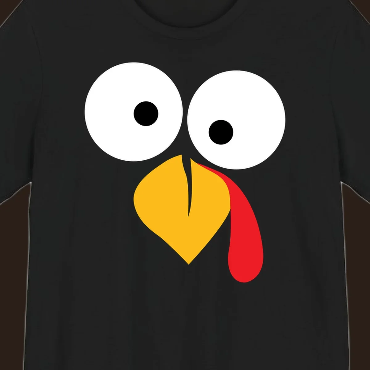 Googly-eyed turkey face illustration with yellow beak and red wattle.