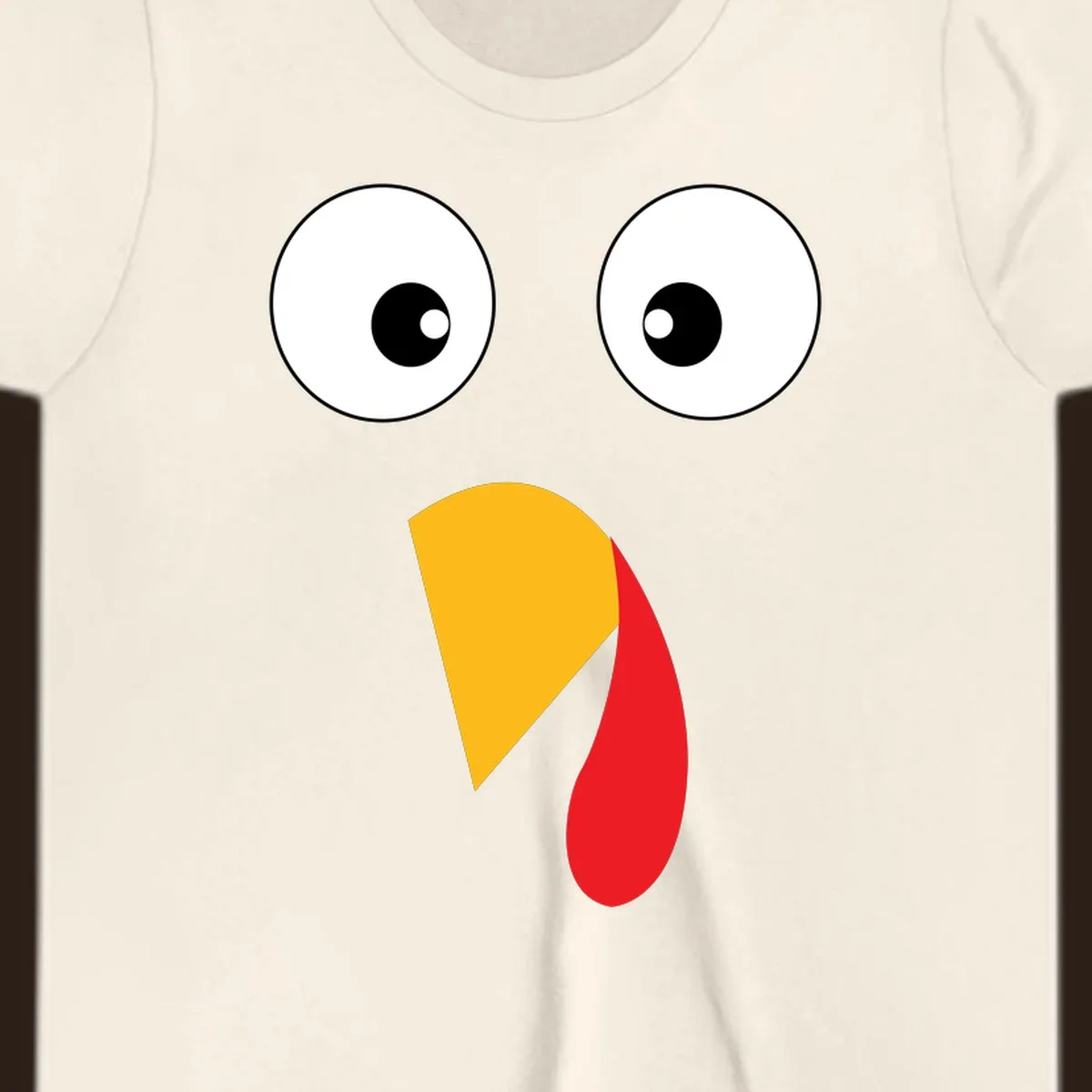 Googly eyed turkey face illustration with yellow beak and red wattle on black background.
