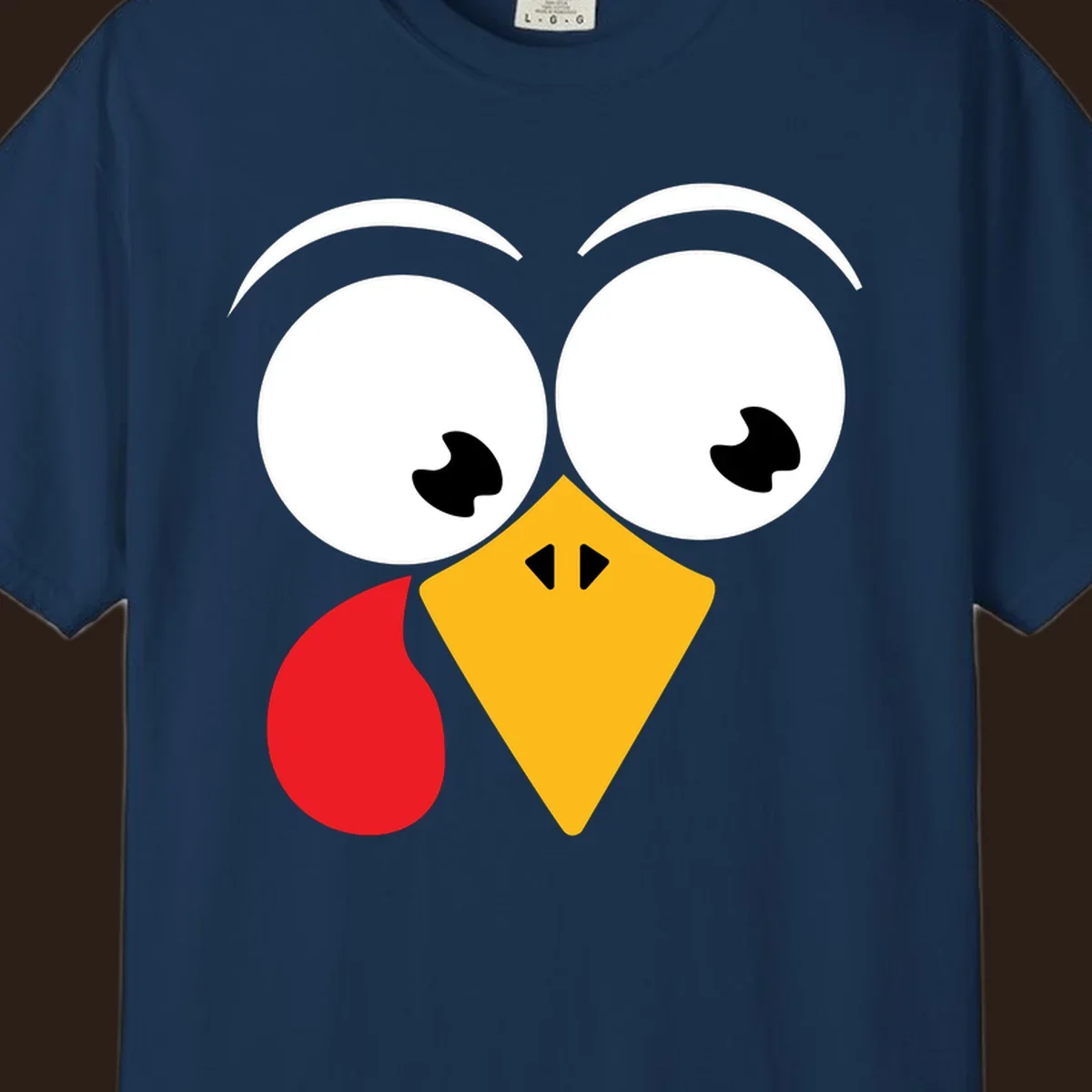 Googly eyed turkey face with yellow beak and red wattle on black background.