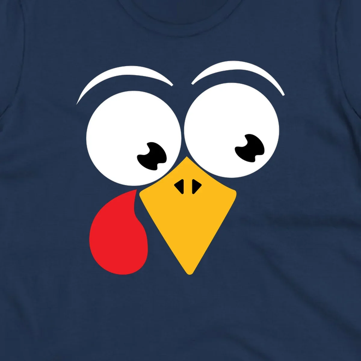 Googly eyed turkey face with yellow beak and red wattle on black background.