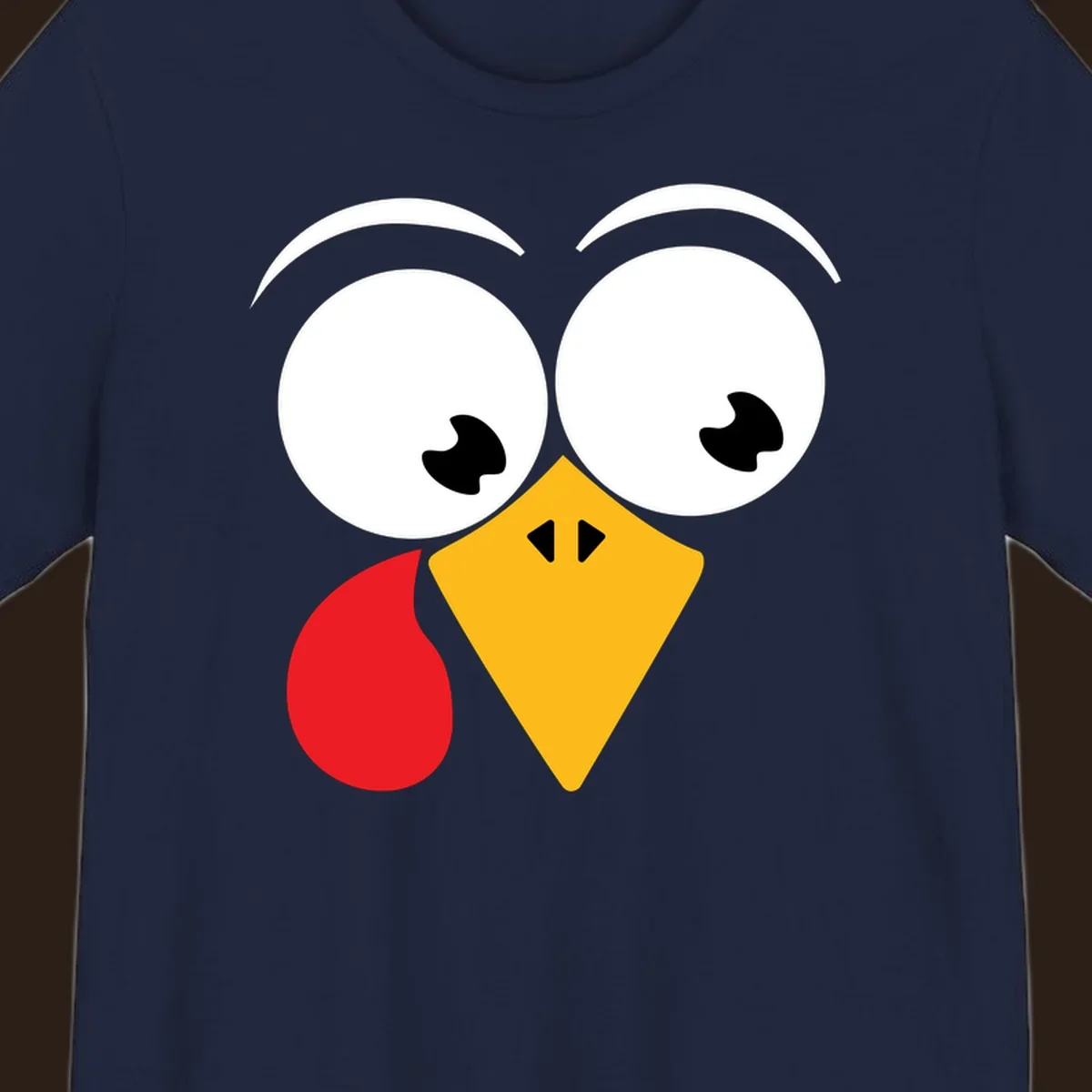 Googly eyed turkey face with yellow beak and red wattle on black background.
