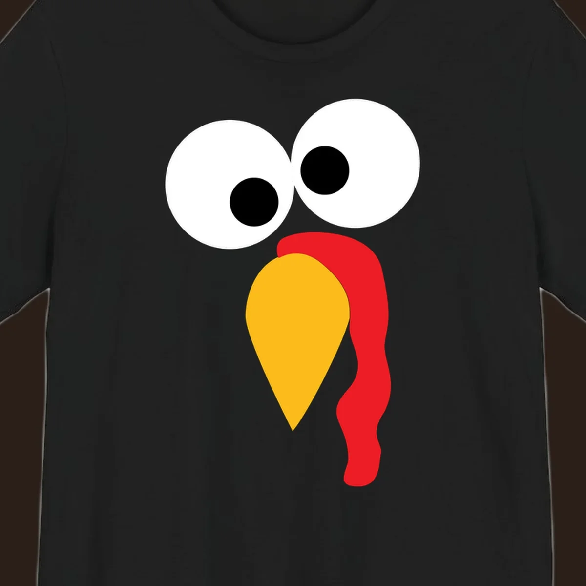 Googly-eyed turkey face illustration with yellow beak and red wattle.