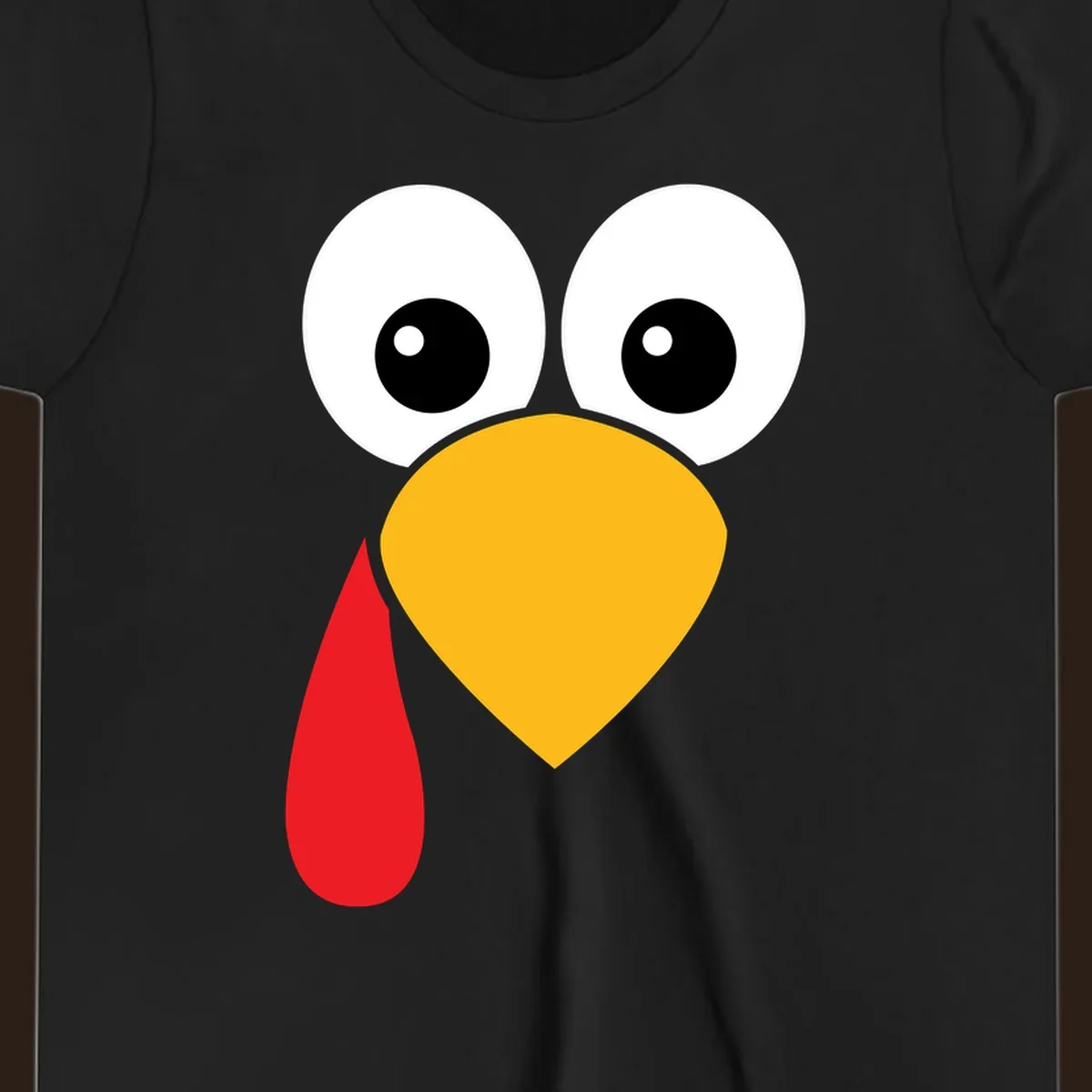 Funny turkey face illustration with big eyes, yellow beak, and red wattle for Thanksgiving.